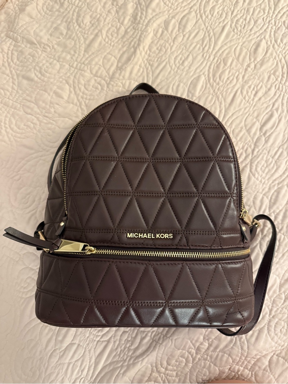 MICHAEL KORS Quilted Backpack in maroon/dark purple with Gold Hardware.